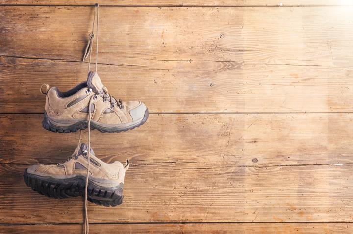 hiking shoes wooden board background